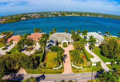 Subdivision in Florida located beside a lake Aerial skyline shot