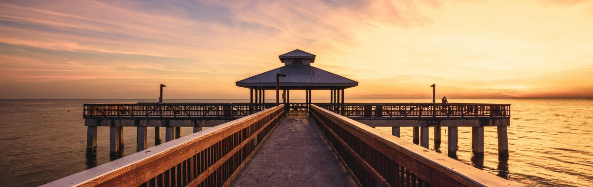 sunset over the fort myers pier, near Estero, florida