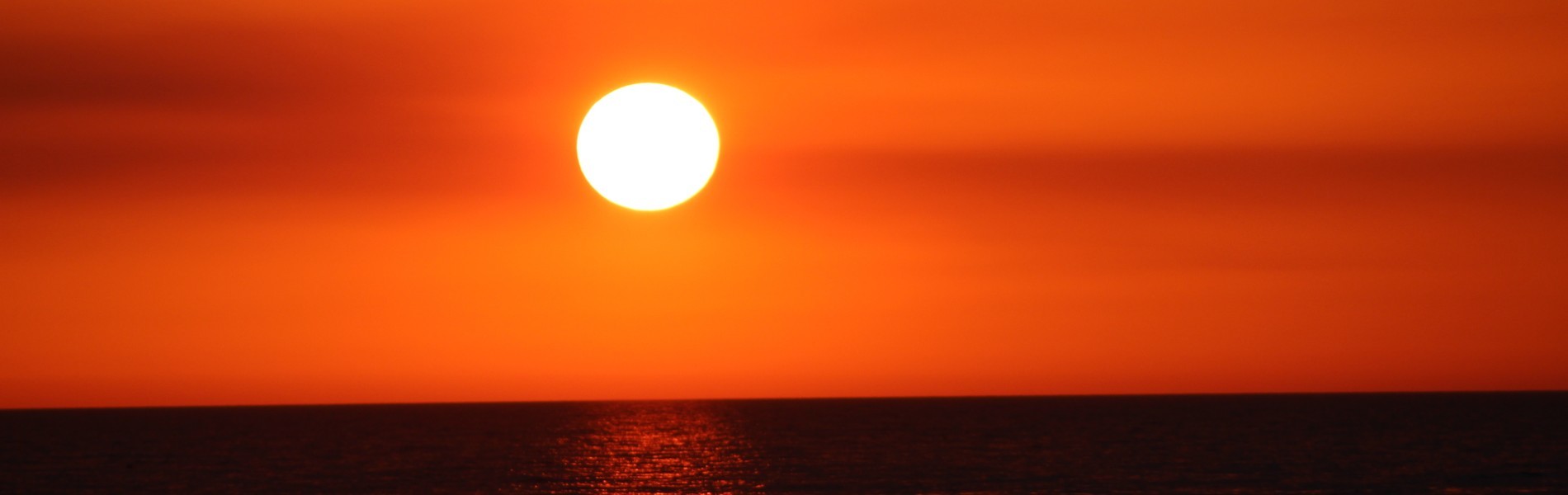 beautiful orange sunset over water near naples, florida