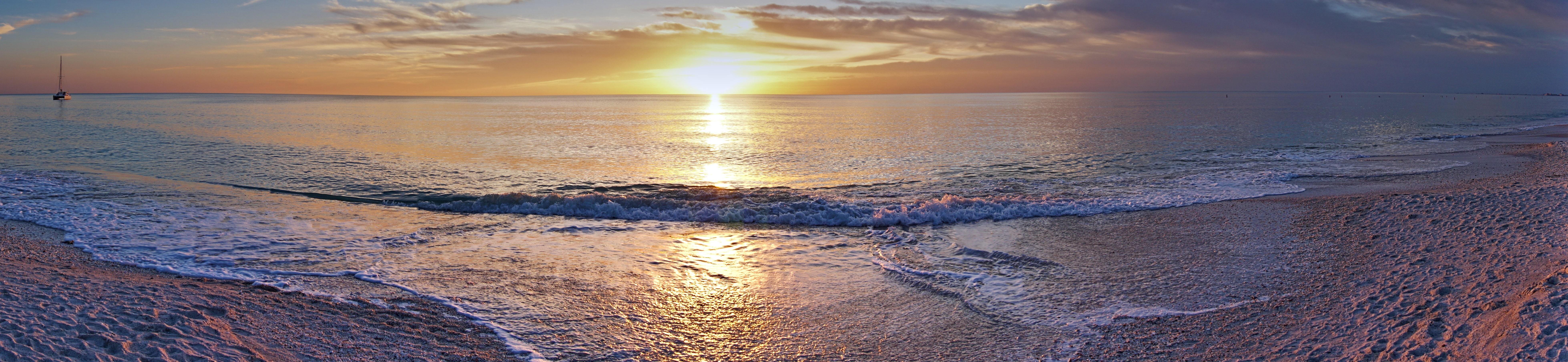 stunning sunrise over beach in naples, florida